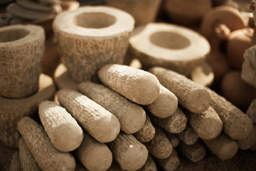 Stone products on market in Myanmar. Mortars and pestles close u