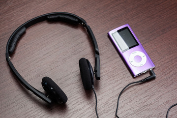 headphones on wooden background