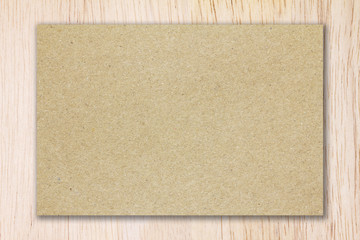 Recycled brown paper on nature wood background panels with copy space for text or image.