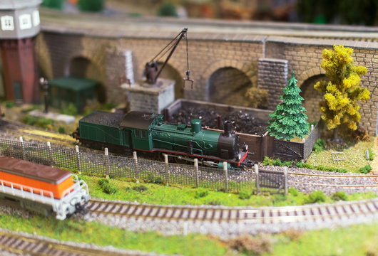 City in miniature. Model of train on railstation.