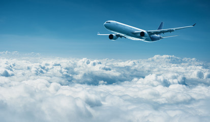 Fototapeta na wymiar Airplane flies above clouds - air travel