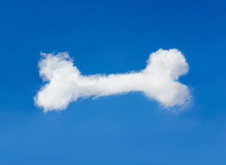 white cloud in blue sky with form of dog bone. animal food dream