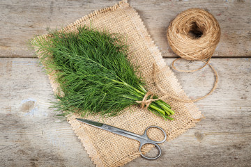 Fresh dill on an wooden surface