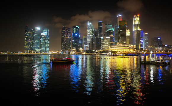 Brilliantly Lit Singapore Skyline from the Harbor at Night