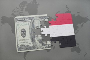 puzzle with the national flag of yemen and dollar banknote on a world map background.
