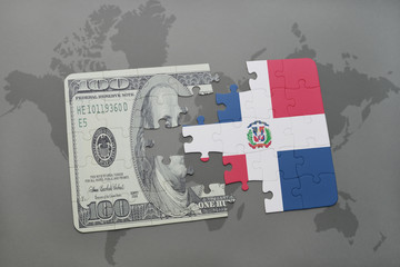 puzzle with the national flag of dominican republic and dollar banknote on a world map background.