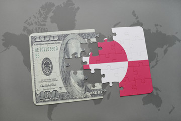 puzzle with the national flag of greenland and dollar banknote on a world map background.