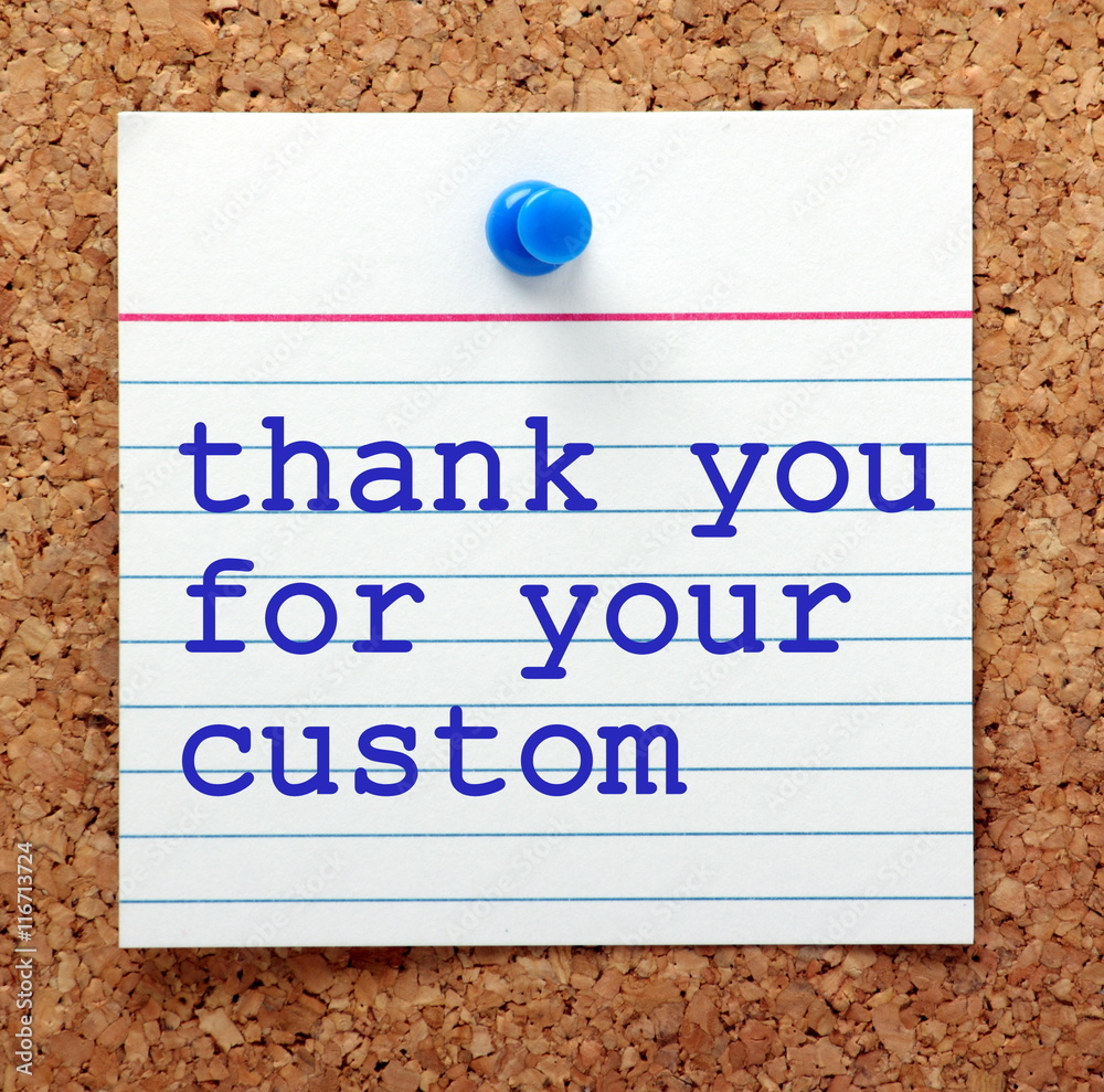 Fototapete the words thank you for your custom in blue text on a note card pinned to a cork notice board as a r