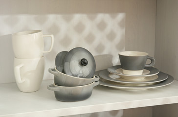 Dishes in cupboard in the kitchen
