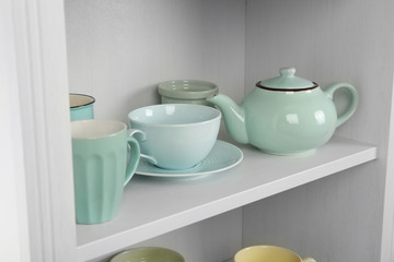 Dishes in cupboard in the kitchen