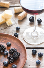 Bowl of blackberries on the wooden table