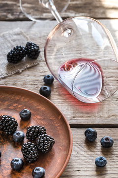 Bowl of blackberries on the wooden table