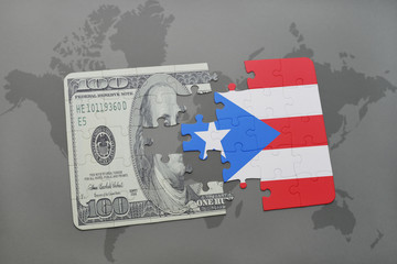 puzzle with the national flag of puerto rico and dollar banknote on a world map background.