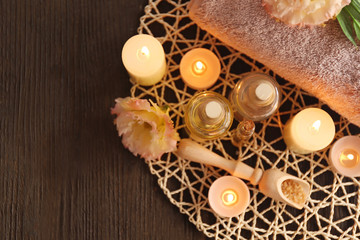 Beautiful spa composition with flowers on wooden background