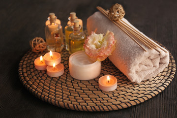 Beautiful spa composition with flowers on wooden background