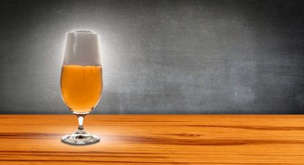 glass beer before chalkboard
