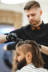 Barber doing haircuts for client