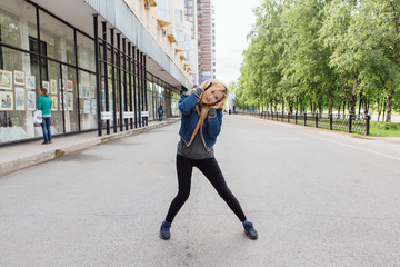 Girl listening to music streaming with headphones.