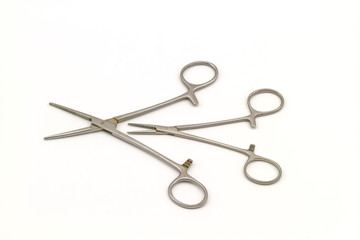 Surgical instrument (hemostat or artery clamp ) on white background