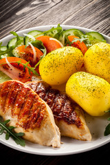 Grilled chicken fillets, boiled potatoes and vegetable salad 