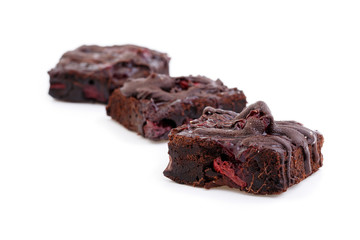 Delicious vegetarian brownie with cherries isolated on white bac