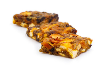 Tasty vegetarian granola crumble cake with dried fruits isolated