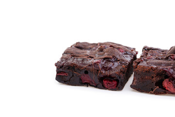 Delicious vegetarian brownie with cherries isolated on white bac