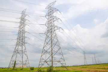 electricity telegraph pole in rural green field