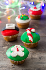Christmas cupcakes on rustic wooden background

