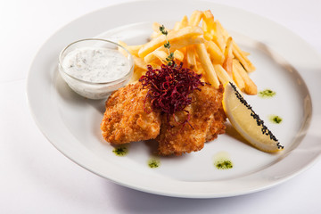 dish of meat in batter and fried potatoes