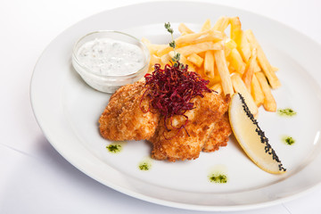 dish of meat in batter and fried potatoes