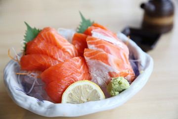 salmon sashimi on wood background japanese food