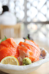 salmon sashimi on wood background japanese food