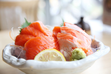 salmon sashimi on wood background japanese food