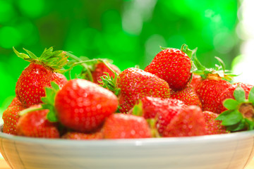 fresh strawberries closeup on the blurry background
