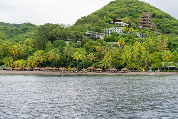 houses on a hillside on the shores of the ocean, St Lucia, Carib
