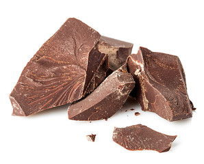 Chocolate pieces close-up isolated on a white background.