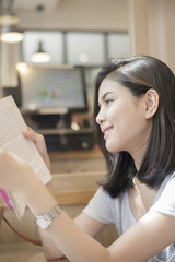 A portrait of an Asian university student on campus