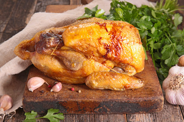 baked chicken on chopping board