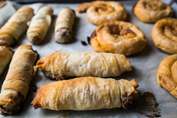 strifti pita borek with cheese, spinach or leek on a tray