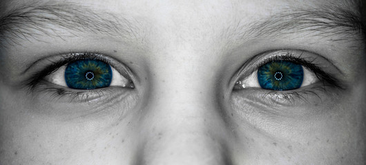 mystical eyes of a child black and white photo, blue color