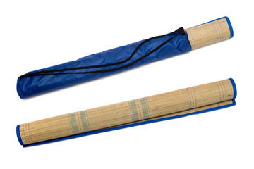 Rolled straw mat isolated over white background