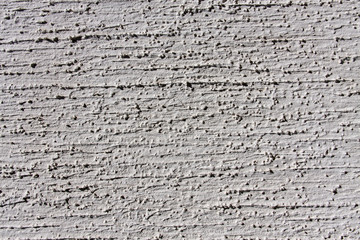 grey wall with decorative plaster as a background