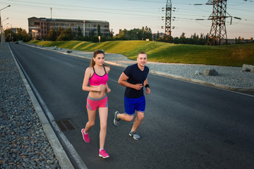 Full length portrait of athletic couple running