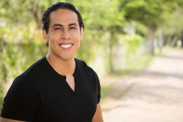 Hispanic man smiling.