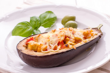 Grilled and filled eggplant half, close up