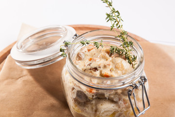 Roast in the pot on a wooden plate