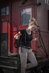 The woman emerges from the historical train in Toronto, Canada