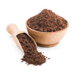 Cocoa powder in a wooden bowl isolated on white