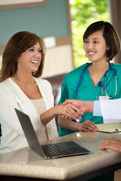 Doctor shaking hands with a patient.